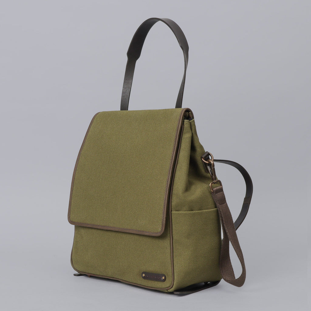 Green canvas diaper bag backpack